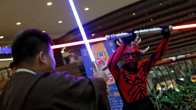 Fans dressed as the characters from Star Wars react during Star Wars Day in Taipei. (REUTERS) Fans dressed as the characters from Star Wars react during Star Wars Day in Taipei. (REUTERS)
