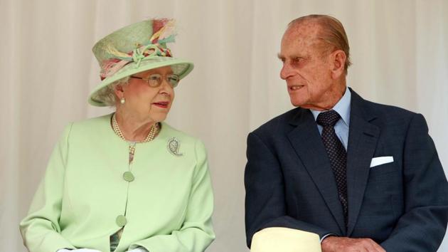 File photo from October 2011 shows Britain's Queen Elizabeth II with Prince Philip during their visit to Brisbane. Prince Philip, the 95-year-old husband of Queen Elizabeth II, will retire from public engagements later this year, Buckingham Palace said on May 4, 2017.(AFP)