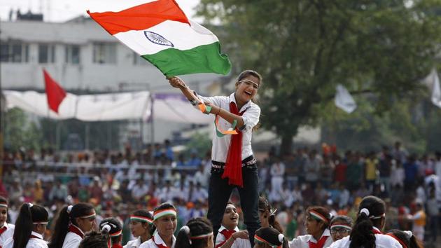 A school girls waves the Indian national flag as she performs on the occasion of 69th anniversary of India's independence from British rule, in Jammu, India, Saturday, Aug. 15, 2015.(AP Representative Photo)