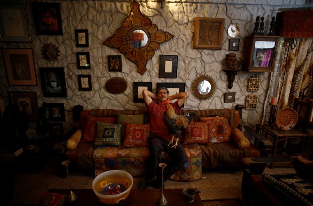 Martin Herrera, poses with his favorite rooster “Paquito” in his house . (Juan Carlos Ulate / Reuters) Martin Herrera, poses with his favorite rooster “Paquito” in his house . (Juan Carlos Ulate / Reuters)
