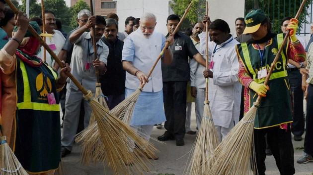 Prime Minister Narendra Modi wields a broom with NDMC workers to launch the Swachh Bharat Abhiyan in New Delhi in 2014.(PTI File Photo) Prime Minister Narendra Modi wields a broom with NDMC workers to launch the Swachh Bharat Abhiyan in New Delhi in 2014.(PTI File Photo)