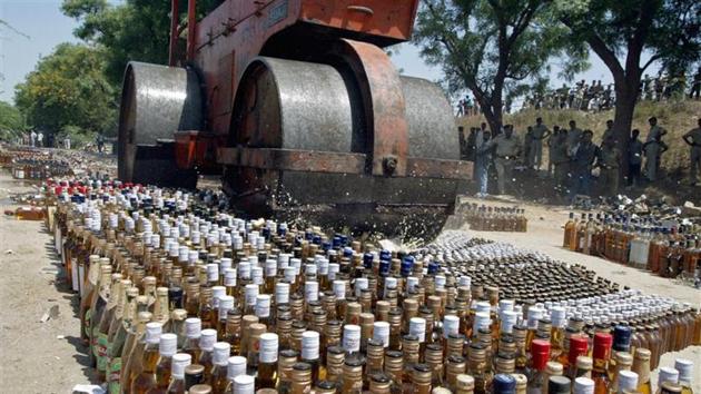 A roller crushes liquor bottles at Koba village, about 18 km (12 miles) north from Ahmedabad, in this file photo from 2006.(REUTERS) A roller crushes liquor bottles at Koba village, about 18 km (12 miles) north from Ahmedabad, in this file photo from 2006.(REUTERS)