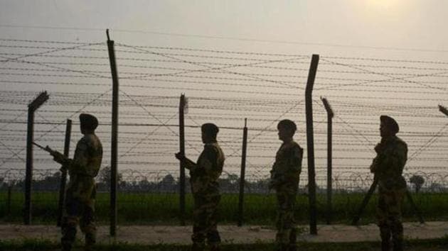 Security personnel patrolling along a fence at the India-Pakistan border, at Wagah.(AFP File Photo) Security personnel patrolling along a fence at the India-Pakistan border, at Wagah.(AFP File Photo)