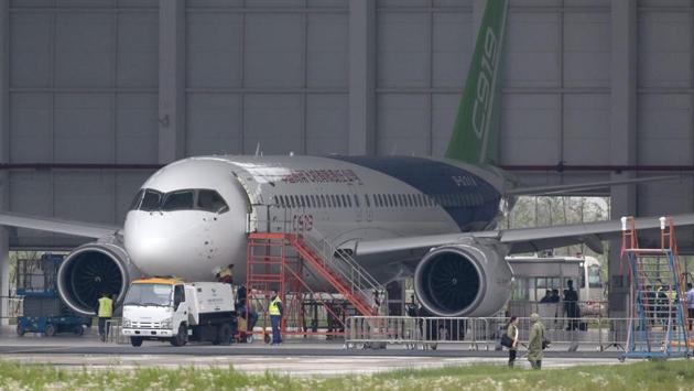 China's C919 passenger jet is seen in a hangar at Shanghai's Pudong airport. (AFP) China's C919 passenger jet is seen in a hangar at Shanghai's Pudong airport. (AFP)