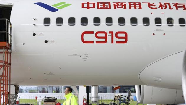 A worker walks past a COMAC C919 aircraft in an air plane hangar in Shanghai. (AP) A worker walks past a COMAC C919 aircraft in an air plane hangar in Shanghai. (AP)