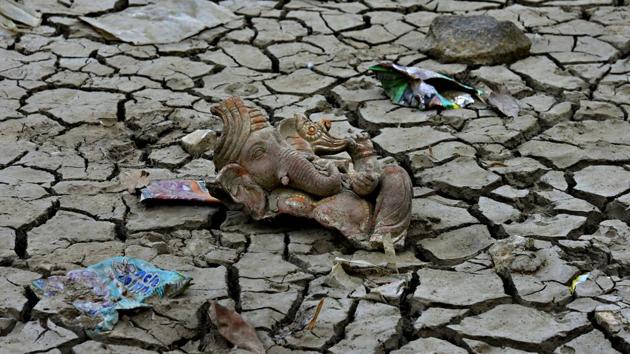 Remains of an idol on the sun crackled land in the lake bed at the Old Fort. (Raj K Raj/HT PHOTO)