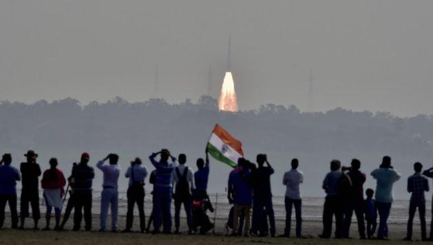 People watch as a rocket from the Indian Space Research Organisation (ISRO) takes off successfully to launch a record 104 satellites, including India’s earth observation satellite on-board PSLV-C37 from the spaceport of Sriharikota in February 2017. (PTI File Photo) People watch as a rocket from the Indian Space Research Organisation (ISRO) takes off successfully to launch a record 104 satellites, including India’s earth observation satellite on-board PSLV-C37 from the spaceport of Sriharikota in February 2017. (PTI File Photo)