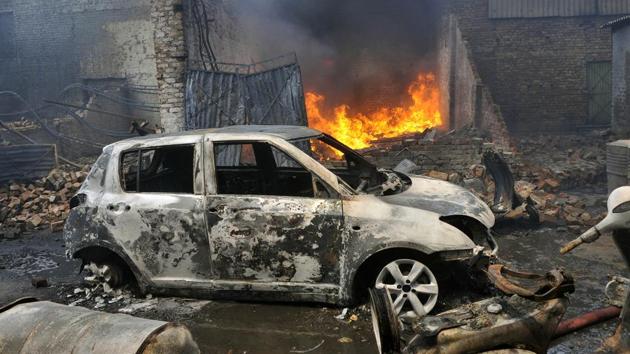 Vehicles damaged in a fire at a plastic factory in Ludhiana on Friday, May 5. (Gurminder Singh/HT)