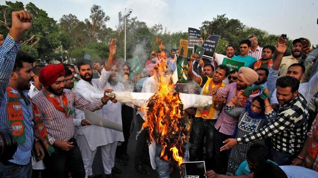 People shout slogans and burn an effigy in Chandigarh during a protest against the killing of two Indian soldiers in Kashmir. (REUTERS) People shout slogans and burn an effigy in Chandigarh during a protest against the killing of two Indian soldiers in Kashmir. (REUTERS)