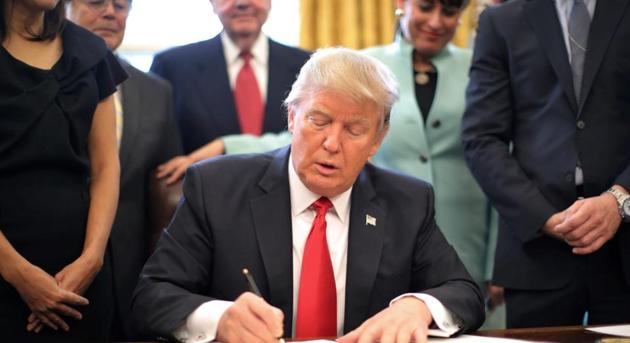 President Donald Trump signed his first piece of major legislation on Friday, a $1 trillion spending bill to keep the government operating through September.(Reuters File Photo)