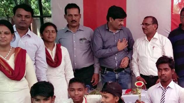 Students of upgraded high school with guests during the school’s annual day programme (HT Photo) Students of upgraded high school with guests during the school’s annual day programme (HT Photo)