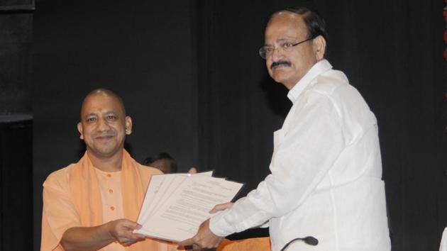 Union urban development minister M Venkaiah Naidu handing over papers regarding release of funds for UP to chief minister Yogi Adityanath in Lucknow on Friday. (HT Photo) Union urban development minister M Venkaiah Naidu handing over papers regarding release of funds for UP to chief minister Yogi Adityanath in Lucknow on Friday. (HT Photo)