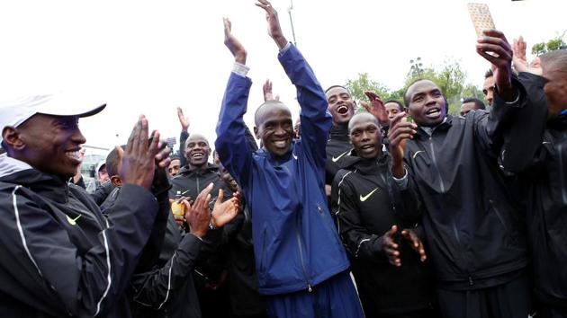 Eliud Kipchoge celebrates with pace-makers after an attempt to break the two-hour marathon barrier at the Monza circuit in Italy. (REUTERS) Eliud Kipchoge celebrates with pace-makers after an attempt to break the two-hour marathon barrier at the Monza circuit in Italy. (REUTERS)