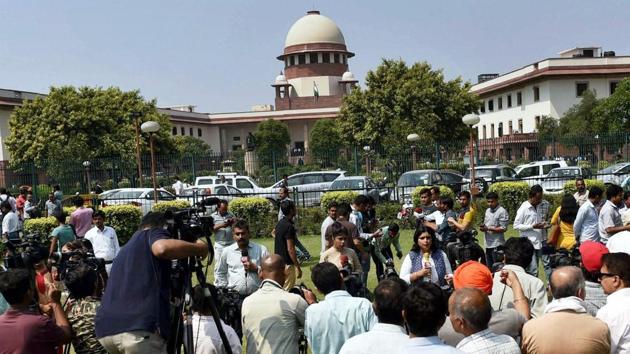 People wait outside the Supreme Court that confirmed death sentence for the four convicts in the December 16 gangrape case, in New Delhi.(PTI Photo) People wait outside the Supreme Court that confirmed death sentence for the four convicts in the December 16 gangrape case, in New Delhi.(PTI Photo)