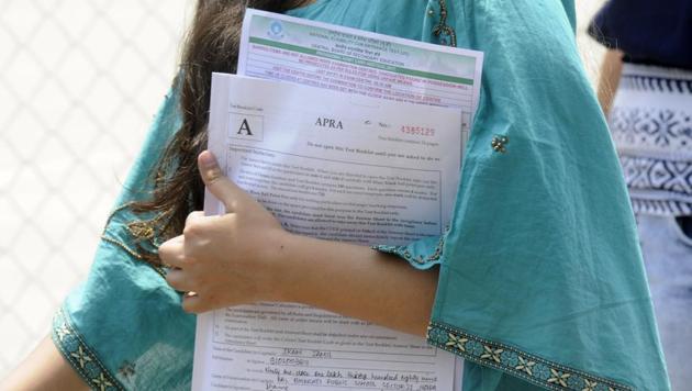 Students come out after appearing for the NEET medical exam in Noida.(Sunil Ghosh/HT Photo)