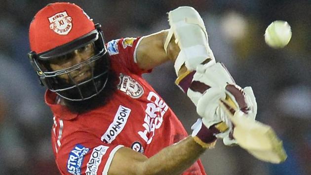 Hashim Amla of Kings XI Punjab hits a boundary during the 2017 Indian Premier League (IPL) match against Gujarat Lions in Mohali on Sunday.(AFP)