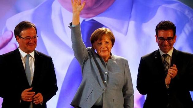 German Chancellor Angela Merkel waves next to CDU's top candidate Armin Laschet (L) at an election rally. (Reuters) German Chancellor Angela Merkel waves next to CDU's top candidate Armin Laschet (L) at an election rally. (Reuters)