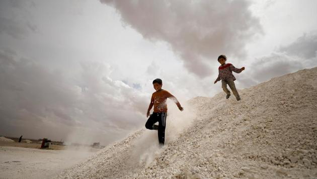 Internally displaced Syrian children who fled Raqqa city, play inside a camp in Ain Issa, Raqqa Governorate, Syria. (Rodi Said/REUTERS)