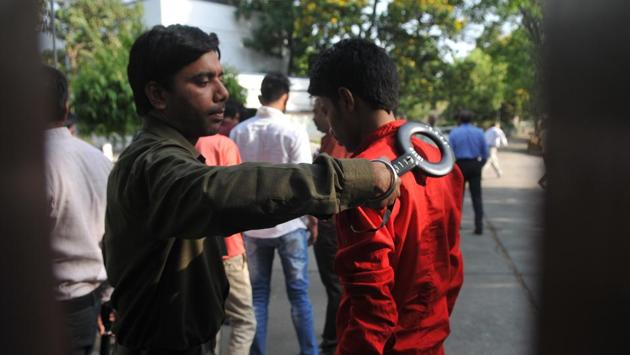 An officer on duty checks a candidate using a metal detector. Candidates were not allowed to carry any material except the admit card and photographs inside the examination hall and were not allowed to leave the centre without completing the entire process. (Mujeeb Faruqui/HT Photo) An officer on duty checks a candidate using a metal detector. Candidates were not allowed to carry any material except the admit card and photographs inside the examination hall and were not allowed to leave the centre without completing the entire process. (Mujeeb Faruqui/HT Photo)