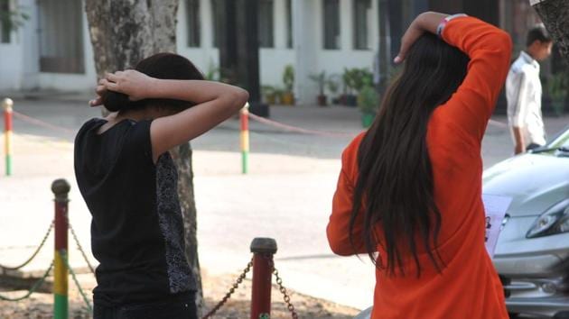 Girls were asked to remove hair clips and were asked to being told to open their ponytails. (Mujeeb Faruqui/HT Photo) Girls were asked to remove hair clips and were asked to being told to open their ponytails. (Mujeeb Faruqui/HT Photo)