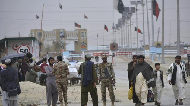 Pakistani paramilitary soldiers stand guard while people wait for the opening of the border crossing in Chaman, Pakistan. (AP FILE) Pakistani paramilitary soldiers stand guard while people wait for the opening of the border crossing in Chaman, Pakistan. (AP FILE)