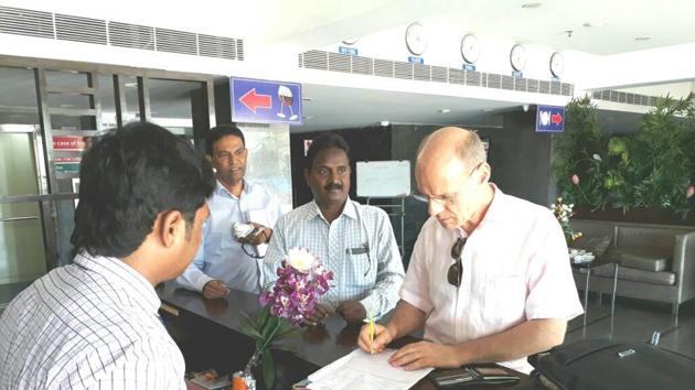 A French consulate official collects details of voters in Yanam. (HT Photo) A French consulate official collects details of voters in Yanam. (HT Photo)