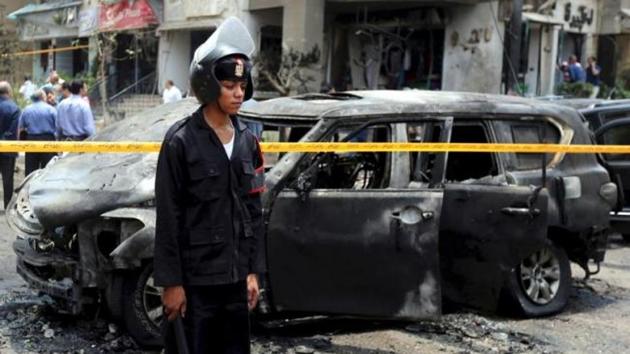 File photo of Egyptian policemen investigating the scene of a car bomb attack on the convoy of public prosecutor Hisham Barakat in Cairo in June 2015. (Reuters) File photo of Egyptian policemen investigating the scene of a car bomb attack on the convoy of public prosecutor Hisham Barakat in Cairo in June 2015. (Reuters)