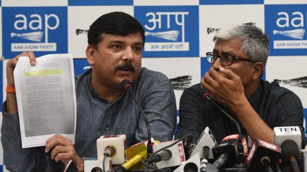 AAP leaders Sanjay Singh, Ashutosh and Dilip Pandey during the press conference in New Delhi where they accused the BJP of conspiring to crush their party.(Ravi Choudhary/HT PHOTO)