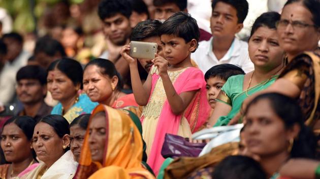 You may be a cop, but I caught you, seems to be the thought on this child’s mind. (Pratham Gokhale/HT Photo) 