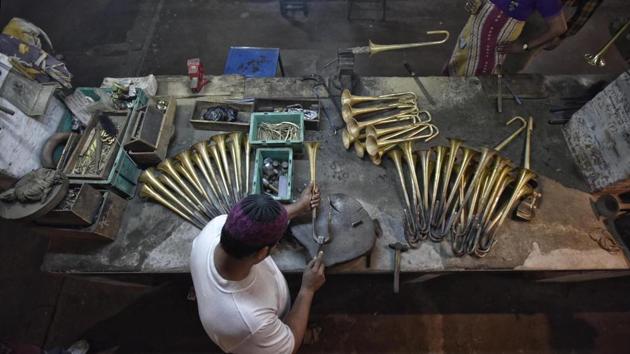 A master craftsman checks the brass tubes and bends them into shape to create music. (Ravi Choudhary/HT PHOTO) A master craftsman checks the brass tubes and bends them into shape to create music. (Ravi Choudhary/HT PHOTO)