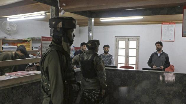 Security forces in a bank after it was looted by suspected militants in Pulwama district of south Kashmir on May 3, 2017. (PTI File Photo) Security forces in a bank after it was looted by suspected militants in Pulwama district of south Kashmir on May 3, 2017. (PTI File Photo)