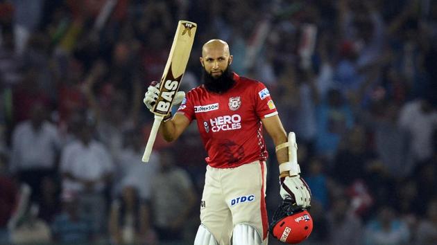 Kings XI Punjab batsman Hashim Amla reacts after completing his century during the 2017 Indian Premier League (IPL) T20 match against Gujarat Lions at the Punjab Cricket Association Stadium in Mohali on Sunday.(AFP)