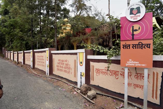 The road leading to Bhilar village where excerpts from books are displayed on walls. (PTI) The road leading to Bhilar village where excerpts from books are displayed on walls. (PTI)