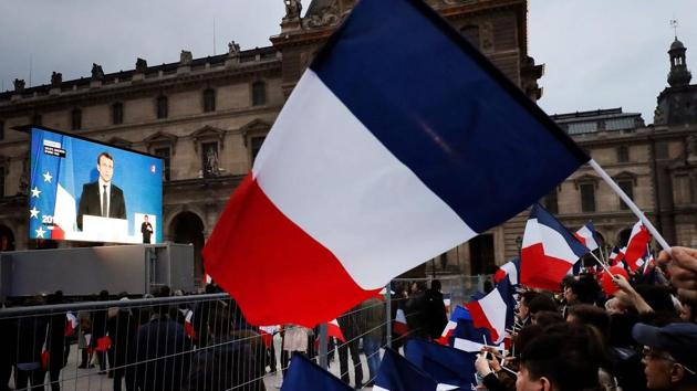 French president Emmanuel Macron delivers a speech as supporters listen at the Pyramid at the Louvre Musuem. His first ceremonial duty comes on Monday when he appears alongside outgoing Socialist President Francois Hollande in Paris to commemorate the defeat of Nazi Germany. (Patrick Kovarik/AFP) French president Emmanuel Macron delivers a speech as supporters listen at the Pyramid at the Louvre Musuem. His first ceremonial duty comes on Monday when he appears alongside outgoing Socialist President Francois Hollande in Paris to commemorate the defeat of Nazi Germany. (Patrick Kovarik/AFP)