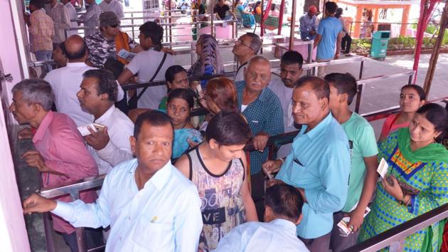 Pilgrims wait for their turn at the registration counters for the Chardham Yatra in Rishikesh(HT Photo) Pilgrims wait for their turn at the registration counters for the Chardham Yatra in Rishikesh(HT Photo)