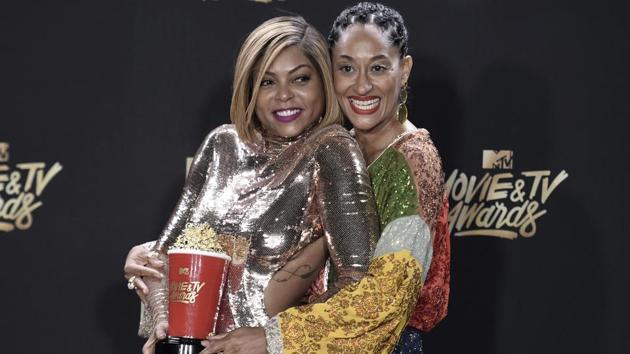 Taraji P. Henson (left) with the award for best fight against the system for Hidden Figures, poses with Tracee Ellis Ross in the press room. (Richard Shotwell/Invision/AP) Taraji P. Henson (left) with the award for best fight against the system for Hidden Figures, poses with Tracee Ellis Ross in the press room. (Richard Shotwell/Invision/AP)