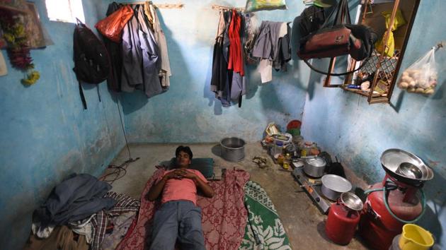 Debendra takes a nap in his one room house that he has rented at Mehrampur villege near the Domestic airport in Delhi. Kapri came to Delhi four years ago from Bihar’s Banka district for earning a living as a taxi driver. (Ravi Choudhary/HT PHOTO)
