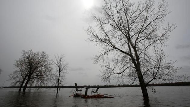 Resident David Swidzinsky has been ferrying neighbors to safety, or back to their homes to collect precious belongings that had been missed in the rush to get out when a state of emergency was declared. (Chris Wattie/REUTERS)