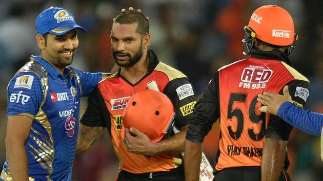 Mumbai Indians (MI) captain Rohit Sharma (L) congratulates Sunrisers Hyderabad’s (SRH) Shikhar Dhawan after the latter guided his team to a seven-wicket win in the Indian Premier League (IPL) 2017.(AFP)