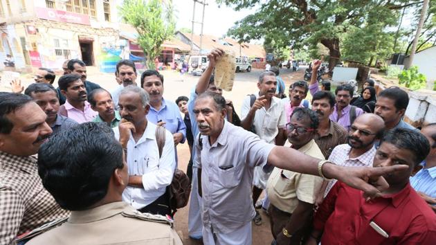 Agitated parents show cut out portions of their children's dress outside a school in Kannur. A girl was forced to remove her inner wear after the metal detector beeped before entering the hall for NEET exam . The CBSE has asked the school principal to apologise. (HT PHOTO) Agitated parents show cut out portions of their children's dress outside a school in Kannur. A girl was forced to remove her inner wear after the metal detector beeped before entering the hall for NEET exam . The CBSE has asked the school principal to apologise. (HT PHOTO)