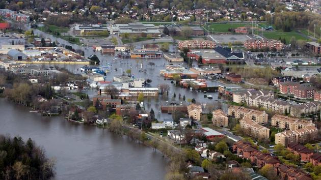 An overhead view showing the flooded residential Montreal suburb of Pierrefonds, Quebec. Canada mobilized its army to help thousands of flood victims try to hold back waters and save their homes Monday after the worst flood in half a century struck, but authorities were optimistic that rising water levels would soon crest. (Christinne Muschi/REUTERS)