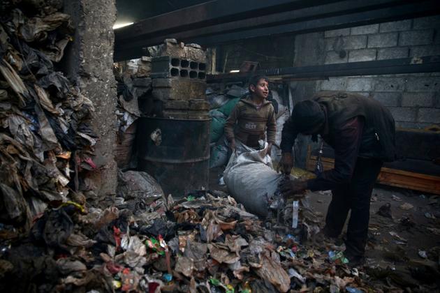 Using methods learned from instructional videos posted on the internet, the family takes plastic bottles, rubble from damaged buildings, plastic from cooking utensils, water and even sewage pipes to produce liquid and gas fuels. (Bassam Khabieh / Reuters) Using methods learned from instructional videos posted on the internet, the family takes plastic bottles, rubble from damaged buildings, plastic from cooking utensils, water and even sewage pipes to produce liquid and gas fuels. (Bassam Khabieh / Reuters)