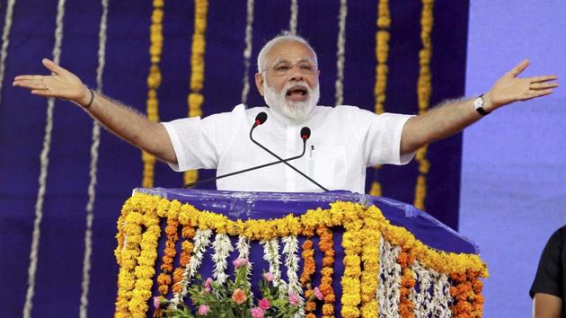 Prime Minister Narendra Modi addresses a gathering at Botad in Gujarat on April 17. Narendra Modi remains such an overwhelmingly dominant figure in Gujarat politics that even after his exit, there is continuity.(PTI)