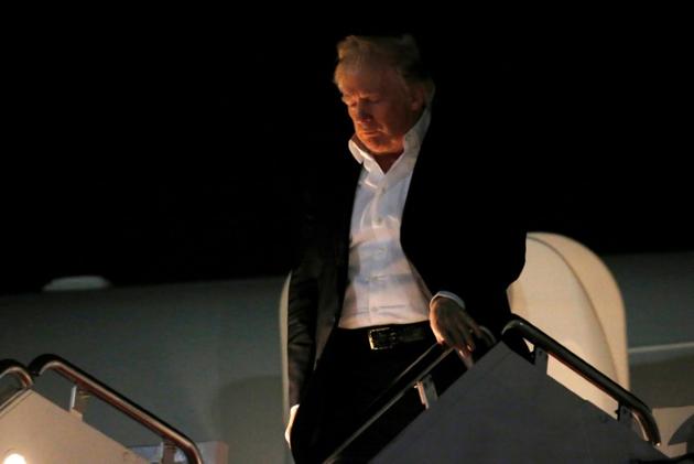 Donald Trump returns from a weekend at his New Jersey golf estate home at Joint Base Andrews, Maryland.(Reuters)