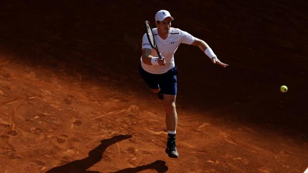 Andy Murray reaches for return in the match against Marius Copil at the Madrid Masters tennis tournament on Tuesday. (AP) Andy Murray reaches for return in the match against Marius Copil at the Madrid Masters tennis tournament on Tuesday. (AP)