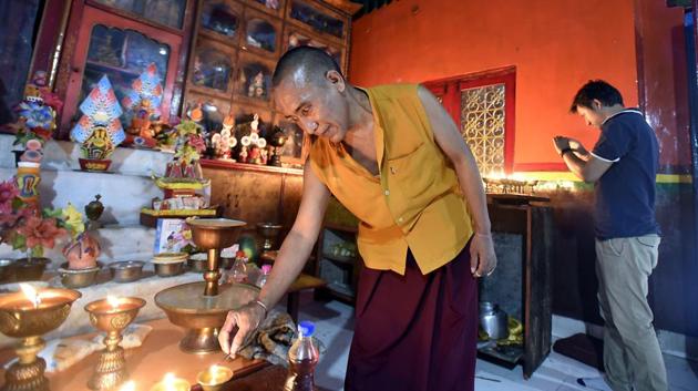 Devotees and monks perform rituals on Vesak Day or Buddha Day at Majnu Ka teela. (Raj K Raj/HT PHOTO) 