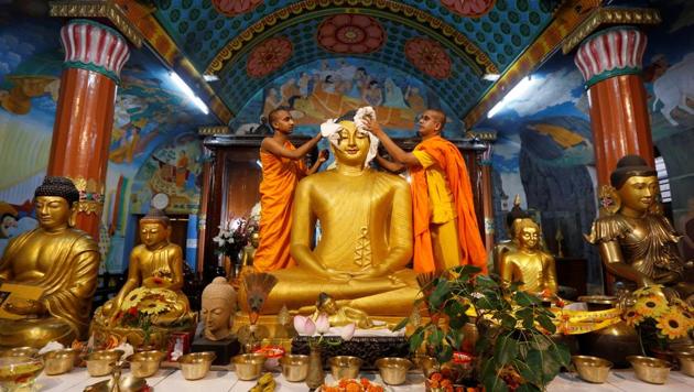 Buddhist monks clean a statue of Lord Buddha inside a temple ahead of the Buddha Purnima festival, also known as Vesak Day, in Kolkata. Buddha Purnima is a festival celebrated with great fervour in countries like India, Sri Lanka, Nepal, Bhutan, Burma, Thailand, Tibet, China, Korea, Laos, Vietnam, Mongolia, Cambodia, Singapore and Indonesia. (Rupak De Chowdhuri/REUTERS)