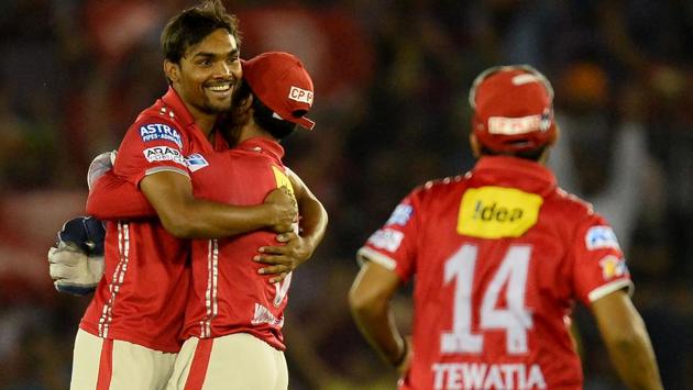 Kings XI Punjab (KXIP) bowler Sandeep Sharma (left) celebrates with wicketkeeper Wriddhaman Saha after picking a Kolkata Knight Riders (KKR) wicket during their Indian Premier League (IPL) match at the Punjab Cricket Association Stadium in Mohali on Tuesday.(AFP)