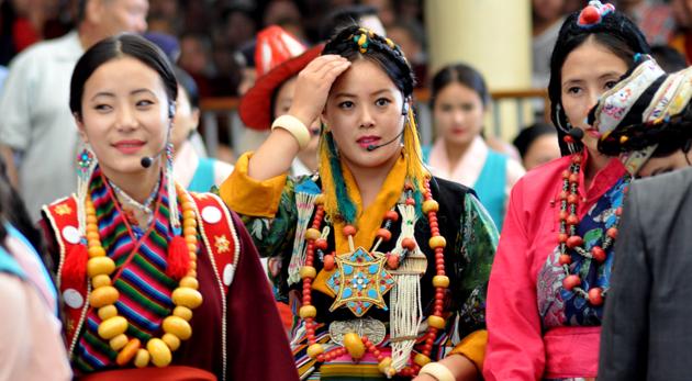Tibetan artistes in their traditional dress, perform a song during to felicitate a group from US Congress delegation at the Tsuglagkhang temple in Dharamsala on Wednesday.  (Shyam Sharma/HT photo) 