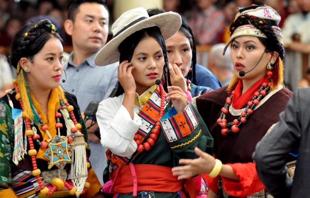 Tibetan artistes in their traditional dress, perform a song during to felicitate a group from US Congress delegation at the Tsuglagkhang temple in Dharamsala on Wednesday.  (Shyam Sharma/HT photo) 